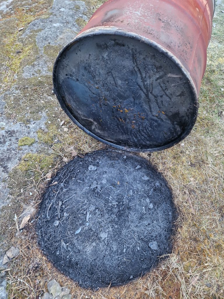 Think about safety when firing pottery in an oil barrel