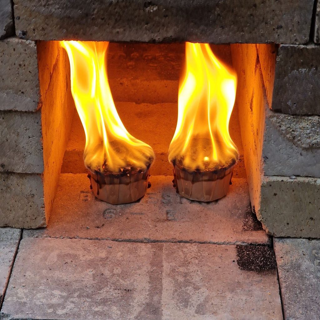 build a wood fired ceramic kiln and fire it, candeling and preheating