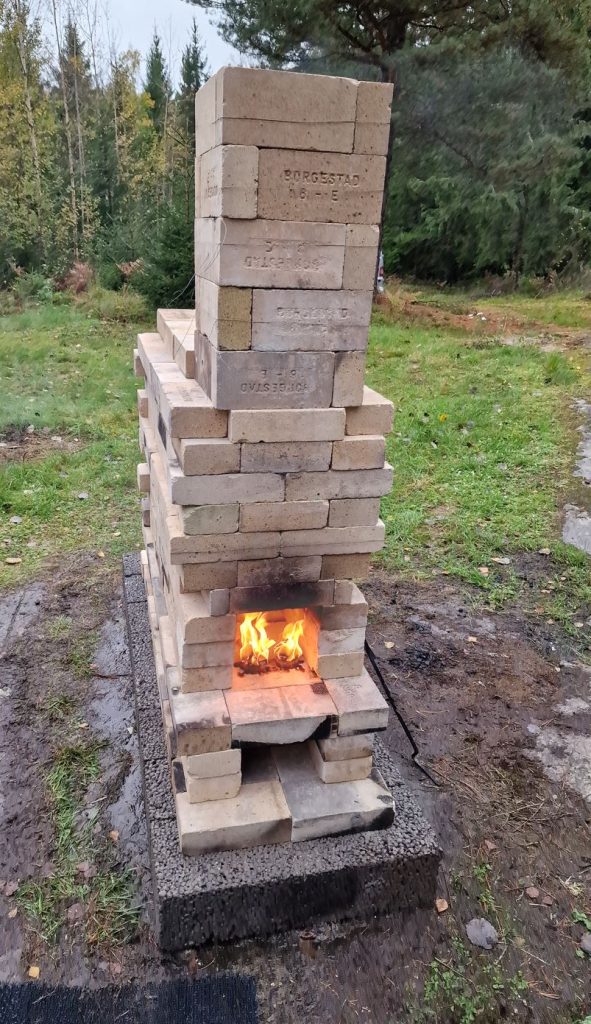 build a wood fired ceramic kiln and fire it, candeling and preheating