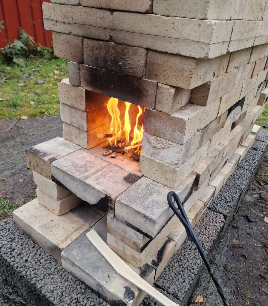 build a wood fired ceramic kiln and fire it, candeling and preheating