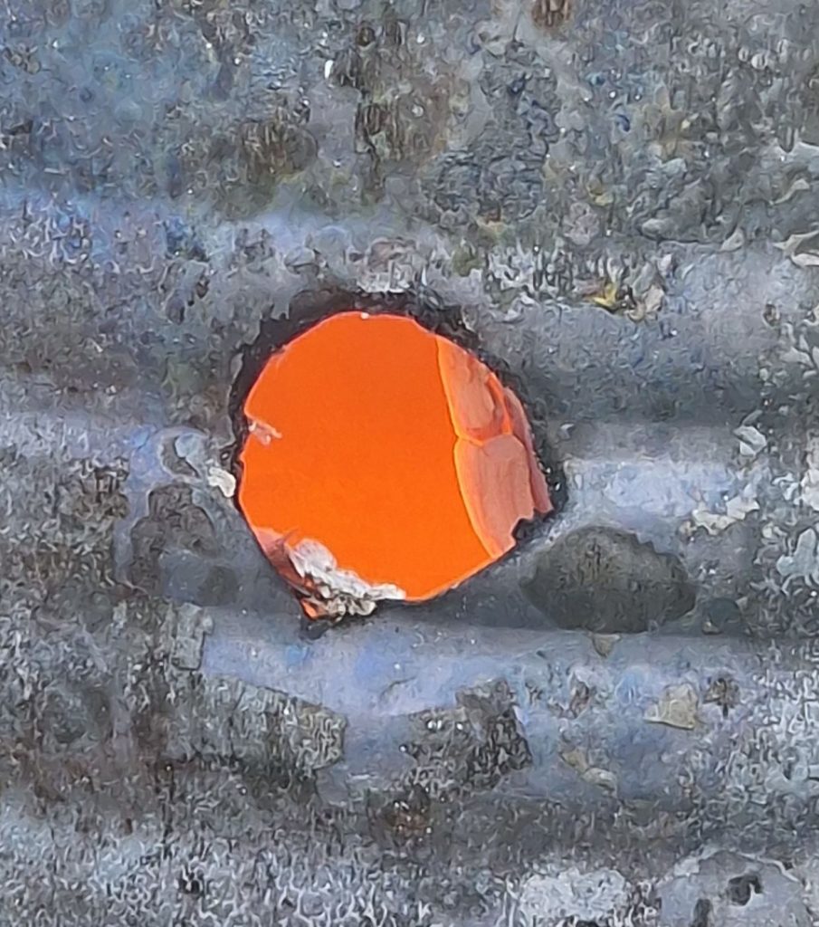 looking inside the burning hot tin can pottery kiln